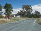 The railway crossing on the northern outskirts of Williamsdale, looking west. The railway marks the boundary between New South Wales and the ACT.