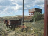 A goods wagon and water tank at the northern end of Cooma rail yard.