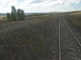 The line briefly approaches the Cooma highway on the left before turning away towards Bunyan.