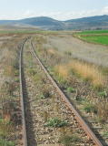 The grass around the railway shows how much land the line occupies on either side of the track.