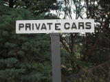 'Private Cars'. Looking through the trees from the car park towards Cooma town.