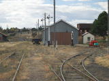 Another look north in between the main and loop lines, showing more detail of the rail yard up to the engine shed. The water tank can also be seen.