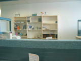 A test shot showing the bookshelf in the Canberra office. In the reflection you can see Leo and me taking the shot.