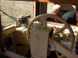 The driver's seat and controls in the rail car.