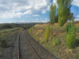 The railway continues underneath a road bridge north of Cooma.