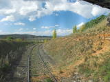 The cutting just beyond the road bridge. The railway continues on quite a sharp curve at this point.