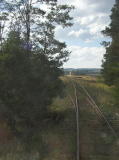 The disused loop line at Chakola station branches away to the left. The passenger platform can be seen in the distance.