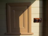 A closer look at the ticket box and adjacent light switches.
