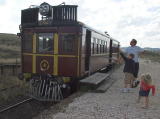 Passengers take a closer look at the Tin Hare at Chakola station.