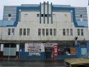 An old building on Whites Line East, with shops that are now closed. The building is likely to be demolished.