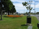 A view looking south from a park bench next to Queens Drive, Lower Hutt. In the background to the right is the Ewan Bridge.