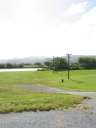 Looking west from the top of Whites Line West. The power poles show the direction where a road bridge was originally planned to connect Whites Line West with Wakefield Street on the opposite side of the Hutt River.