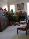 The Christmas tree with presents wrapped and waiting to be opened.