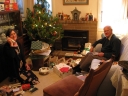 Mum and Dad after the presents were opened. Mum is on the phone to Lisa. Shortly we all participate in a five-way phone conversation with Lisa and Jenny.