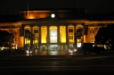 Wellington Railway Station at night. The clock at the top shows ten minutes to twelve.