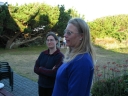 In the foreground, Snaiet and Denise. In the background, Paul and Haydn deal with the barbecue. The sun hangs low over the back yard of the Sand Castle Motel, Peka Peka.