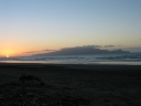 The sun has almost finished setting next to Kapiti Island.