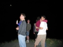 The gang at midnight on Peka Peka beach. In the background is where the beach would be. The moon is clearly visible at the top.