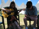 Snaiet and Haydn sing harmonies under a tree at the Sand Castle Motel.