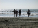Snaiet, Jann, Denise, and Haydn leave the water of Peka Peka beach.