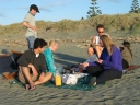Haydn, Mauricio, Jann, Paul, Denise, and Snaiet each fish 'n' chips on Peka Peka beach.
