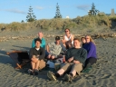 The whole gang pose for a photo. The couple who appeared in the last two shots take this photo.