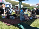 Snaiet, Paul, Haydn, and Denise under the gazebo at Tauherenikau race course. The main grandstand is in the background.