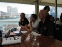 Denise and others at her birthday brunch. In the background is the New Zealand Post building with Gandalf the White on the side.