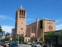 A longer shot of the north and eastern sides of Saint Paul's Cathedral on Molesworth Street, Wellington. Unusually, the cathedral is oriented in a north-south direction. The convention is to use an east-west orientation.