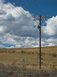 The remaining signalling and communication lines at Michelago. This is looking east from the southern end of the station building.