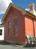 A similar building to the rest room, this one at the southern end of the platform, looking southwest.