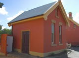 Another look at the southern building, looking northwest. A fridge-freezer is hiding in a corner.