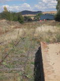A look at the yard south of the station. Some wagons and a shed can be seen in the distance.