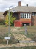 A look east to the northern end of the barracks, and the path leading up to the door.