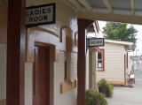 A look north along the platform back to the 'Ladies Room' and 'Gentlemen' signs.