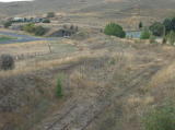 A longer look around the curve to the left, over a railway bridge back to Cooma railway station.