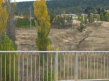 A look south from the Monaro Highway bridge. To the left is a short siding. On the right, a cutting takes the line south towards Bombala.
