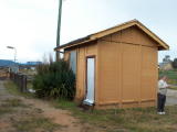 Rylstone railway station, showing the dock and a small disused building.