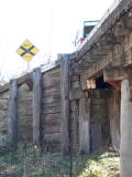 A wing wall at the up end of Guises Creek bridge, showing the kilometre distance from Sydney.