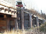The eastern wing wall at the up end of Guises Creek bridge. The high-railer can be seen at the top.