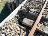 A hole in the decking of the up end of De Salis bridge, north of Michelago.