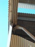 A closer look at the damage at the top of the carriage shed door, Michelago, following recent heavy wind.