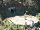 Water tank and brickwork at Michelago Creek, as viewed from the railway bridge at the down end of the yard.