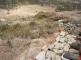 Re-filling of the track bed begins, first by laying concrete next to the track to keep the ground from futher erosion.