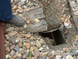 A small hole in the Guises Creek bridge, looking down.