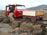 Scouring of the track base and vegetation, on the down side of the railway line, near 343.4km.