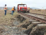 Scouring of the track base and vegetation, on the down side of the railway line, near 343.4km.