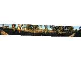A panorama shot of the Kaleen grasslands, where the Gungahlin Drive extension will be built. This shot is composed of eight images. In the middle is a guy walking his dog. Owing to the peculiarities of the photo stitching software, the dog has been removed from the final image.