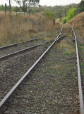 Another look north from the Royalla station yard back towards Queanbeyan. A 40 sign can be seen amongst the weeds.