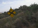 A sign indicating a railway crossing ahead.